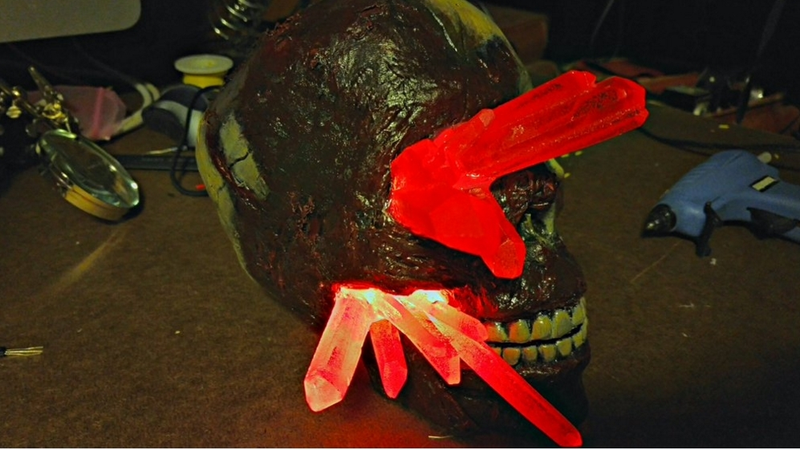 Illustration for article titled Glowing Red lyrium Skull (TW: Gore)